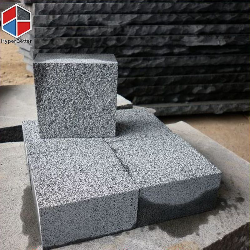 Bush-hammered black basalt cubics